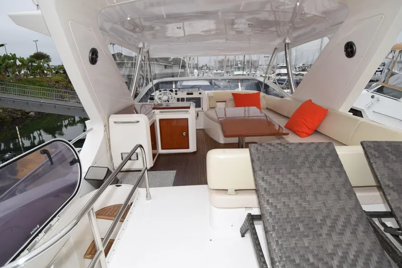 Slide: The Image of Luxurious 2010 Azimut 58 yacht interior with seating, table, and sun loungers. - 26