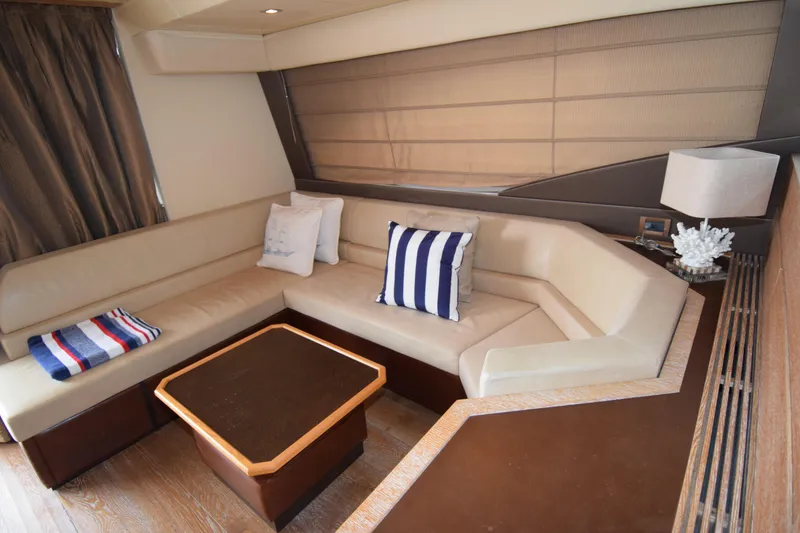 Slide: The Image of Luxurious interior of 2010 Azimut 58 yacht with beige seating and nautical decor. - 3