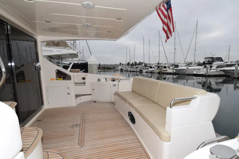 Slide: The Image of Luxurious 2010 Azimut 58 yacht deck with seating, docked in marina. - 38