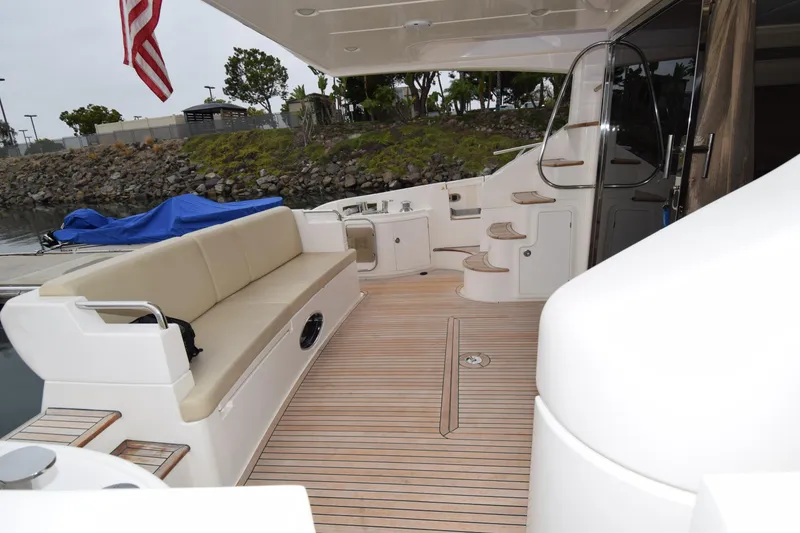 Slide: The Image of Luxurious 2010 Azimut 58 yacht deck with seating and elegant wooden flooring. - 39