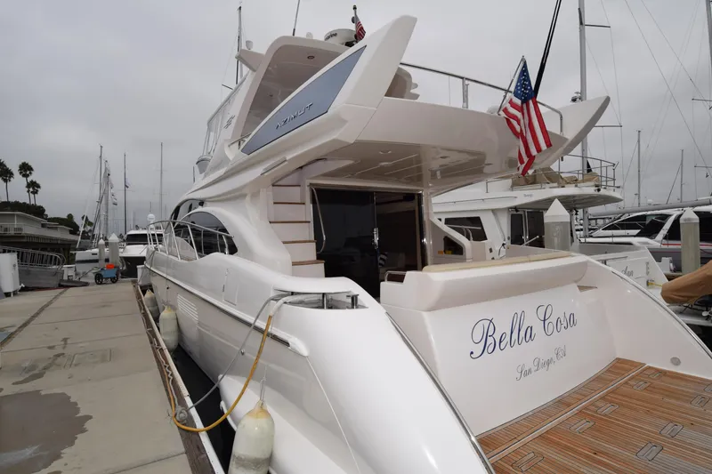 Slide: The Image of 2010 Azimut 58 yacht docked, named "Bella Cosa," with American flag, San Diego. - 40