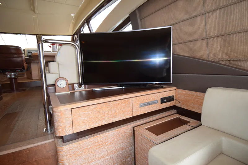 Slide: The Image of Luxurious interior of 2010 Azimut 58 yacht with modern TV and elegant furnishings. - 5