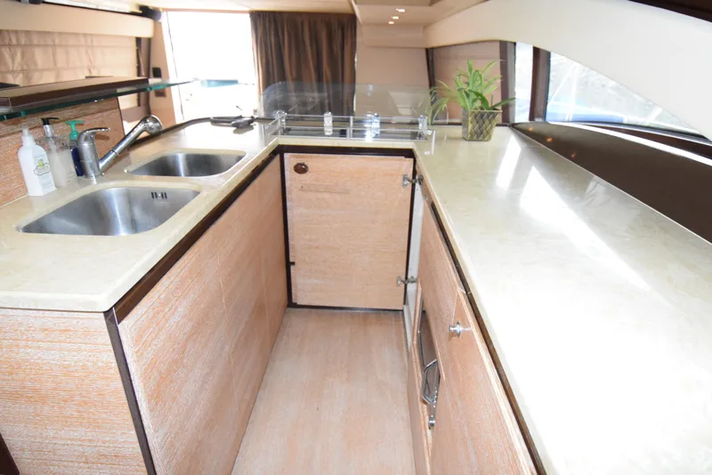 Slide: The Image of Luxurious kitchen interior of 2010 Azimut 58 yacht with dual sinks and modern design. - 9