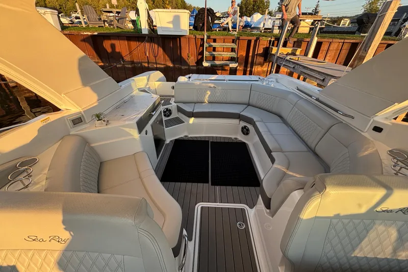 Slide: The Image of Luxurious 2022 Searay SLX350 boat interior with elegant seating and modern design. - 25
