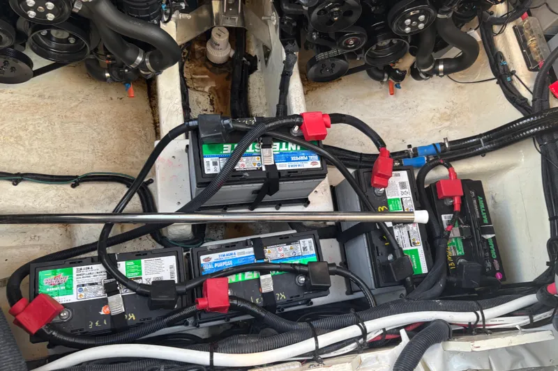 Slide: The Image of Engine compartment of 2022 Searay SLX350 with multiple batteries and wiring. - 29