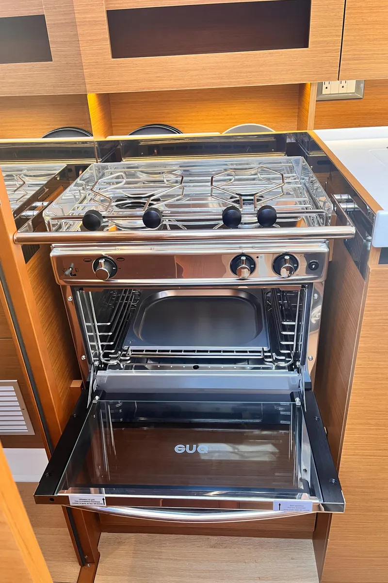 Slide: The Image of Modern kitchen oven and stove in 2024 Jeanneau 380 yacht interior. - 23