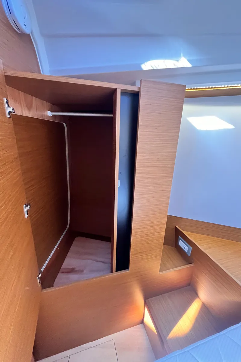 Slide: The Image of 2024 Jeanneau 380 interior closet with wooden finish and modern design. - 35