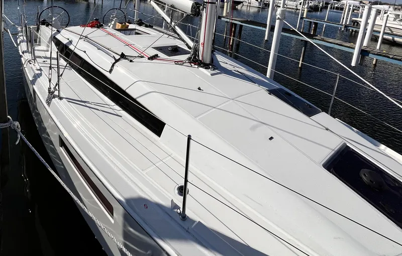 Slide: The Image of 2024 Jeanneau 380 sailboat docked, showcasing sleek design and modern features. - 5