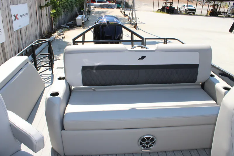 Slide: The Image of 2026 Starcraft SLS 3 Q DH boat interior with cushioned seating and cup holders. - 10