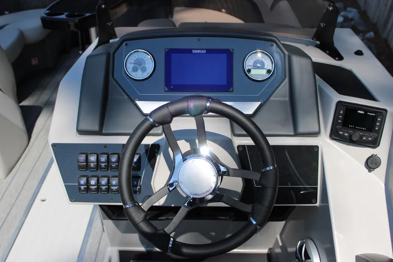 Slide: The Image of 2026 Starcraft SLS 3 Q DH boat dashboard with steering wheel and control panel. - 12