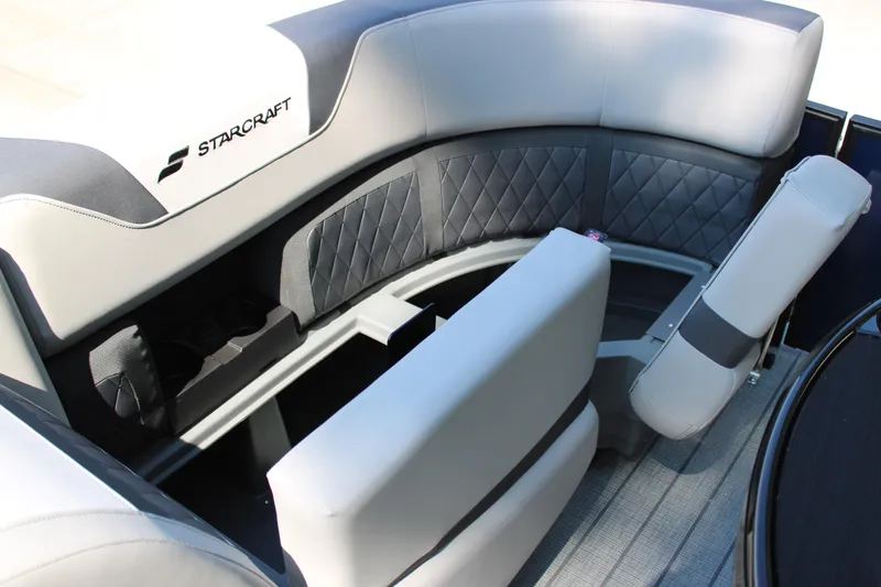 Slide: The Image of 2026 Starcraft SLS 3 Q DH boat interior with luxurious seating and cup holders. - 16