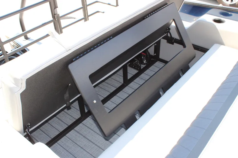 Slide: The Image of 2026 Starcraft SLS 3 Q DH boat storage compartment with open lid. - 18