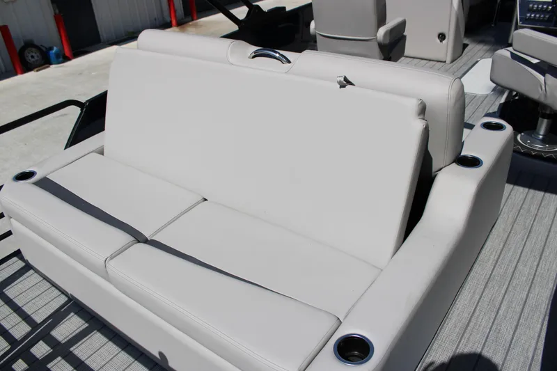 Slide: The Image of 2026 Starcraft SLS 3 Q DH boat interior with gray seating and cup holders. - 19