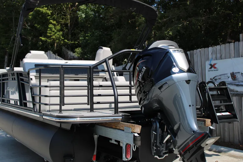 Slide: The Image of 2026 Starcraft SLS 3 Q DH pontoon boat with Yamaha 250 engine, docked outdoors. - 3