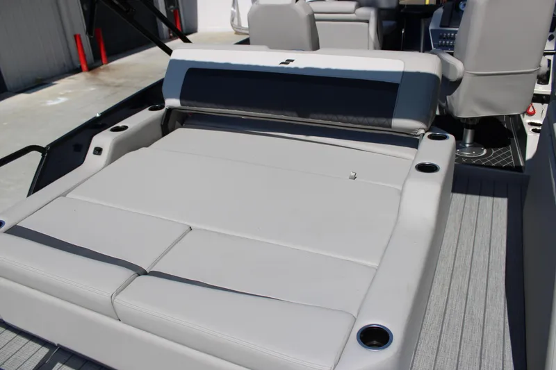 Slide: The Image of 2026 Starcraft SLS 3 Q DH boat interior with cushioned seating and cup holders. - 7