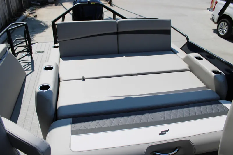 Slide: The Image of 2026 Starcraft SLS 3 Q DH boat interior with gray seating and cup holders. - 9