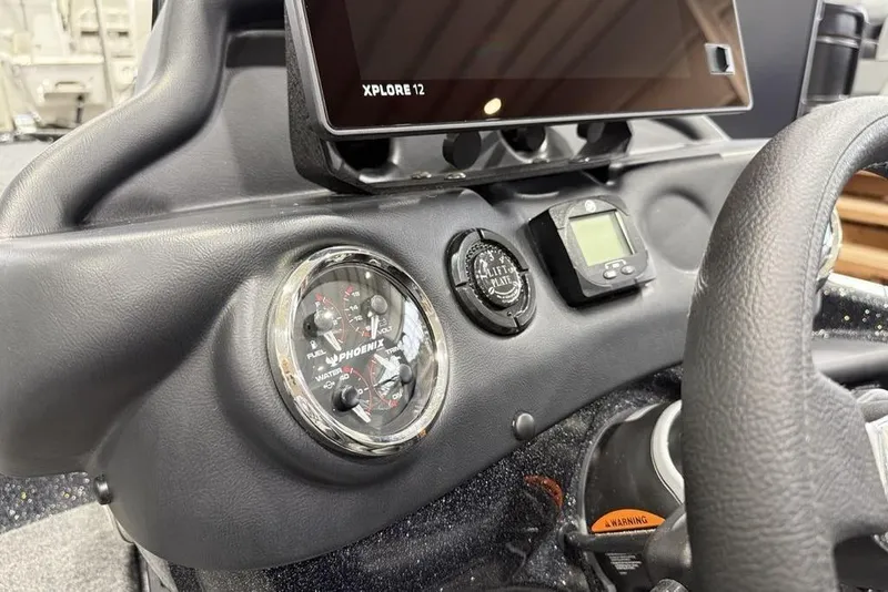 Slide: The Image of Dashboard of 2026 Phoenix 721 ZXL boat with gauges and Xplore 12 display. - 22