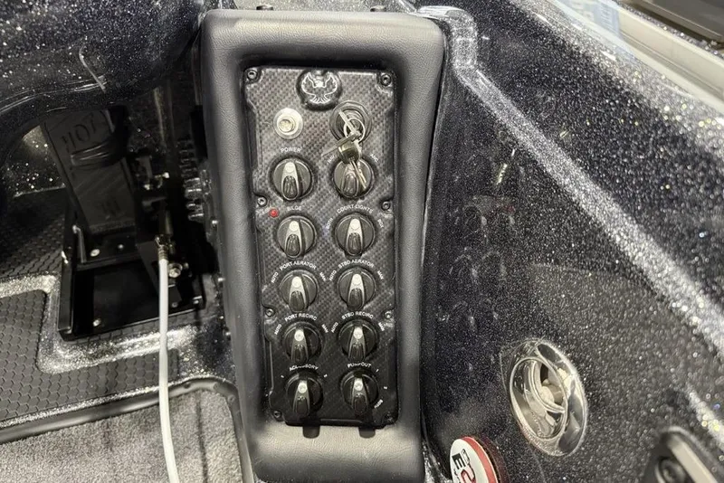 Slide: The Image of Control panel of 2026 Phoenix 721 ZXL boat with switches and key ignition. - 24