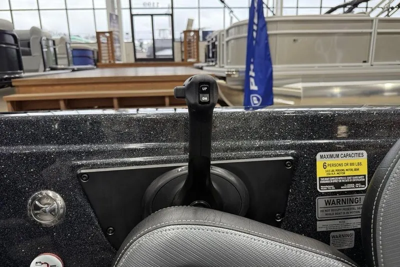 Slide: The Image of Control panel of 2026 Phoenix 721 ZXL boat with capacity warning label. - 28