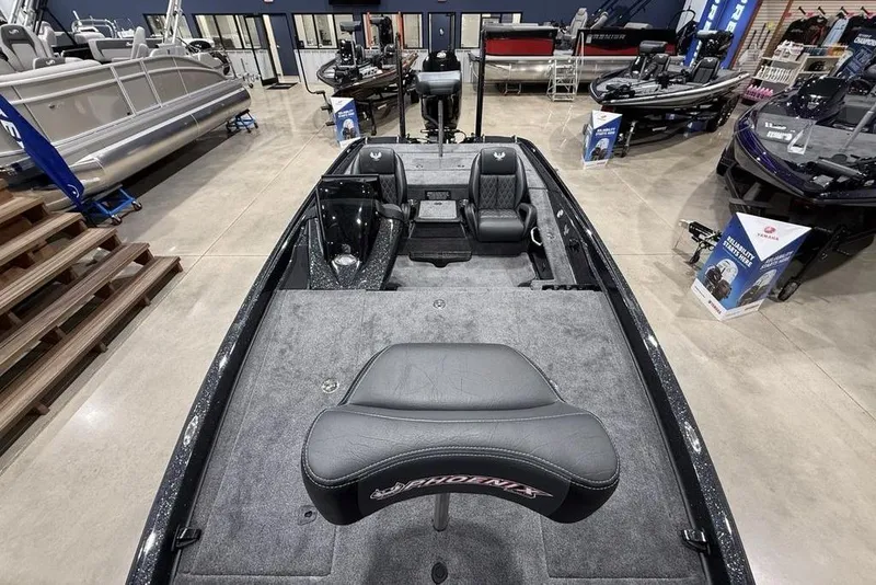 Slide: The Image of 2026 Phoenix 721 ZXL boat interior with seating and carpeted deck in showroom. - 34