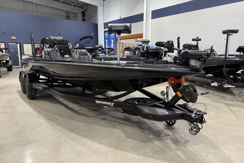 Slide: The Image of 2026 Phoenix 721 ZXL boat displayed in a showroom, showcasing sleek design and modern features. - 5