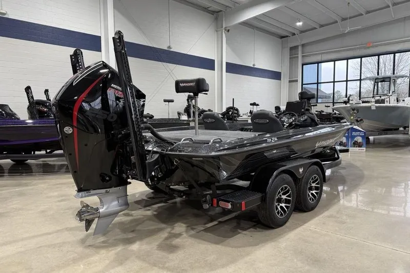 Slide: The Image of 2026 Phoenix 721 ZXL boat in showroom, featuring sleek design and powerful engine. - 6