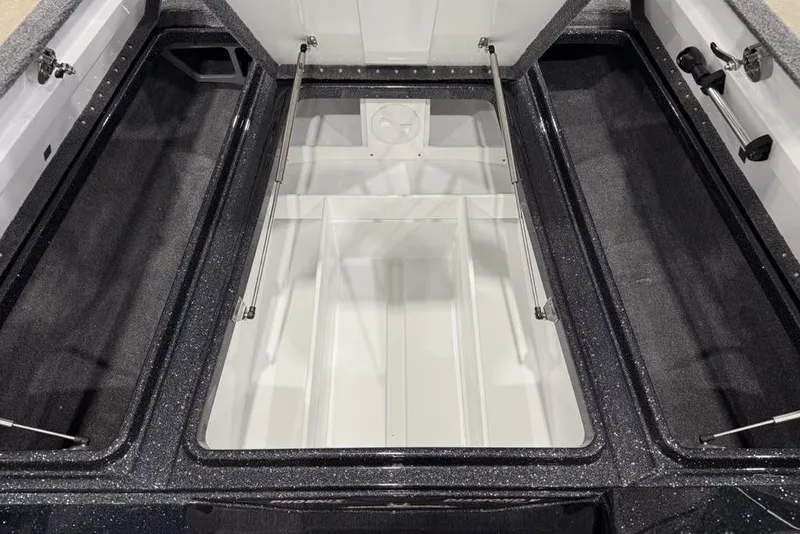 Slide: The Image of Open storage compartment of 2026 Phoenix 721 ZXL boat, featuring spacious interior design. - 8