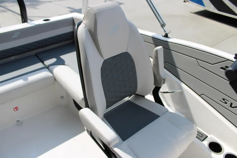 Slide: The Image of 2026 Starcraft SVX 190 OB boat interior with gray and white seating. - 11