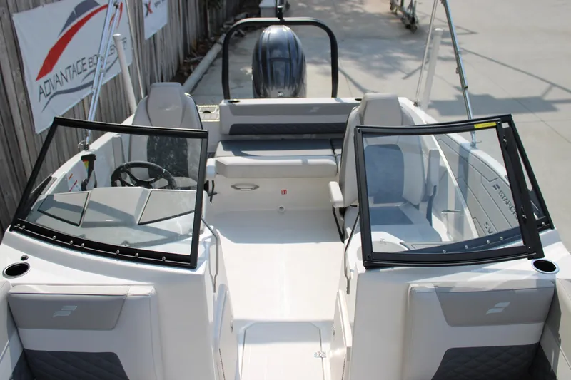 Slide: The Image of 2026 Starcraft SVX 190 OB boat interior with open cockpit and seating. - 13