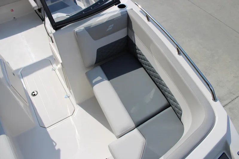 Slide: The Image of 2026 Starcraft SVX 190 OB boat interior with gray cushioned seating. - 14