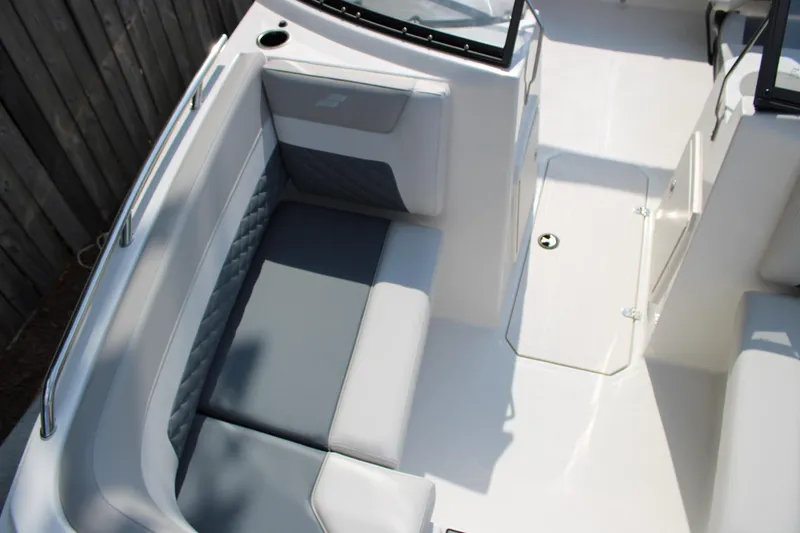 Slide: The Image of Interior seating of 2026 Starcraft SVX 190 OB boat, featuring gray and white upholstery. - 15