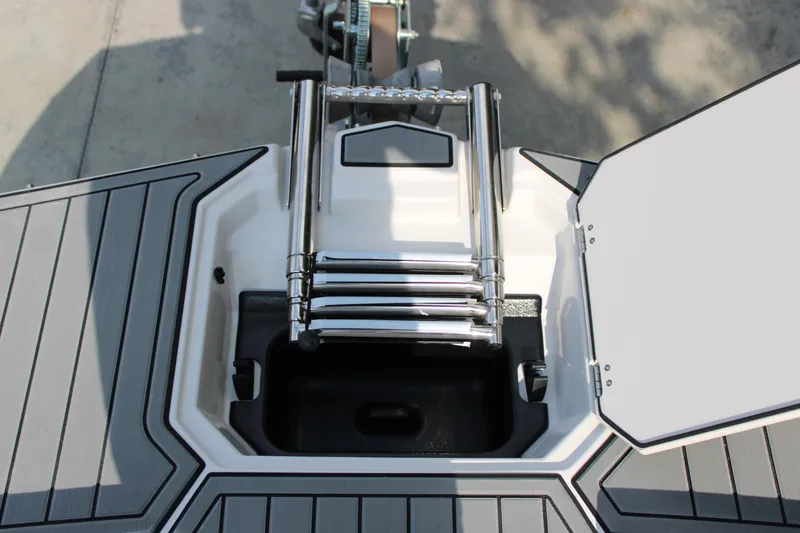 Slide: The Image of 2026 Starcraft SVX 190 OB boat ladder and storage compartment, featuring sleek design and functionality. - 17
