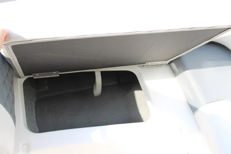 Slide: The Image of 2026 Starcraft SVX 190 OB boat storage compartment with open lid. - 18