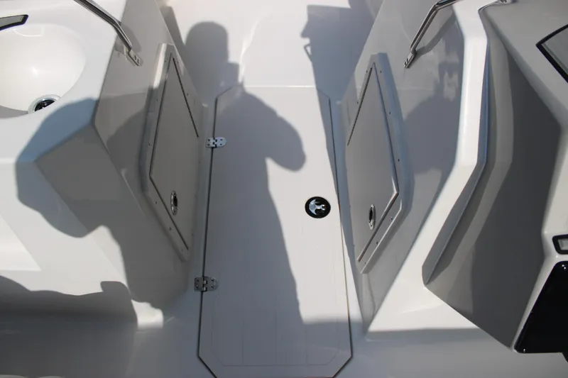 Slide: The Image of 2026 Starcraft SVX 190 OB boat interior with storage compartments and sink. - 19