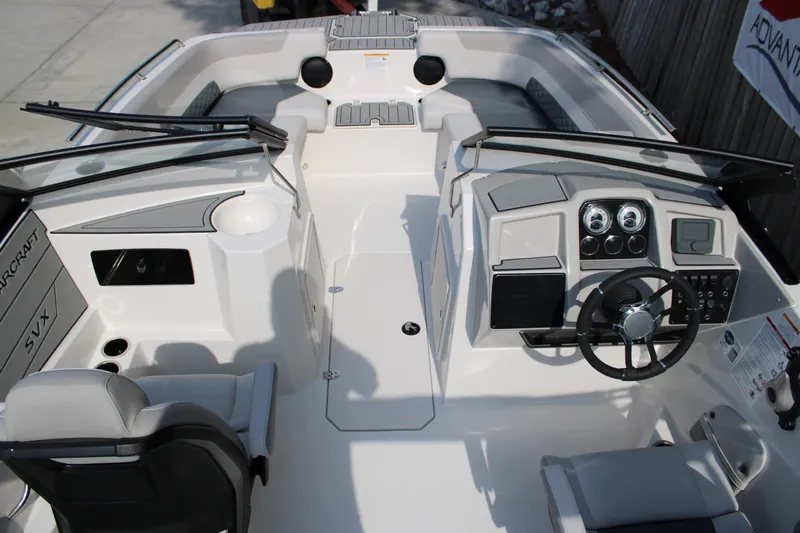 Slide: The Image of 2026 Starcraft SVX 190 OB boat interior with modern dashboard and seating. - 21