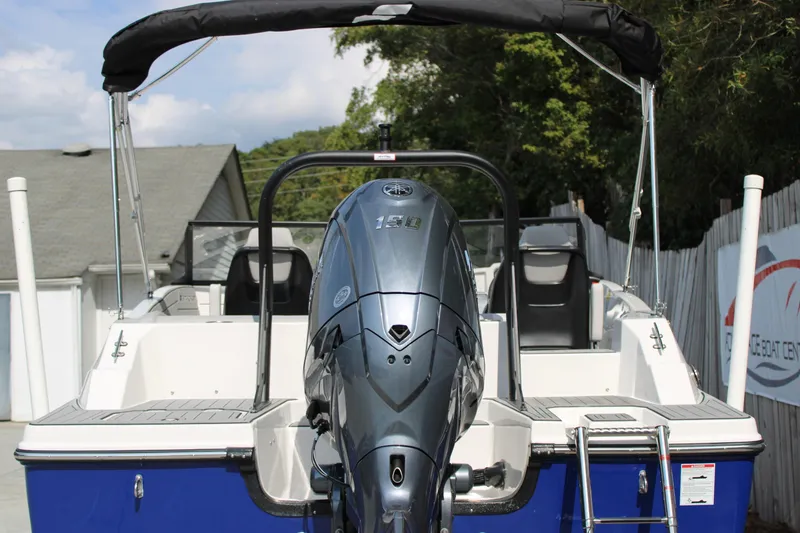 Slide: The Image of 2026 Starcraft SVX 190 OB boat with outboard motor, docked outdoors. - 4