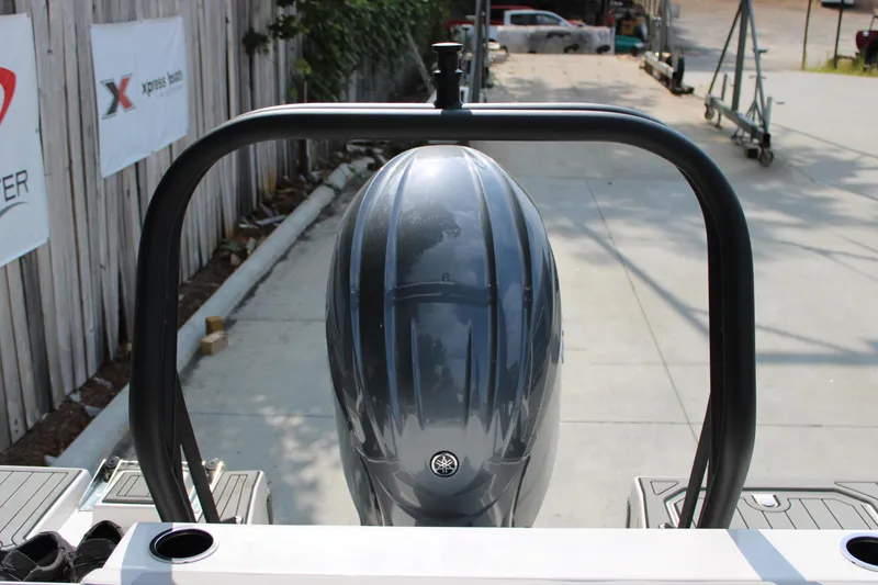 Slide: The Image of 2026 Starcraft SVX 190 OB boat engine, viewed from the rear on a sunny day. - 6