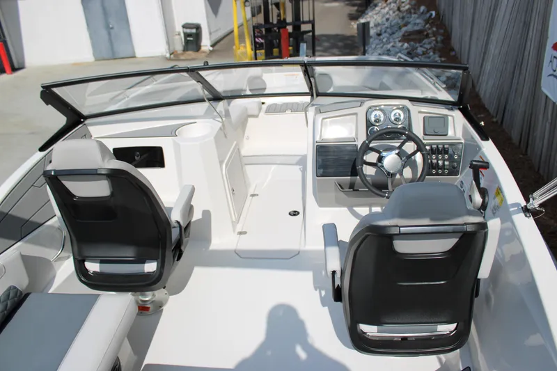 Slide: The Image of 2026 Starcraft SVX 190 OB boat interior with modern dashboard and seating. - 7