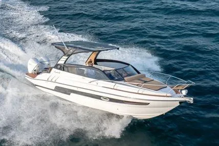 The Image of Hanover 305 White and Black Premium Edition boat cruising on open water, 2026 model. - 0