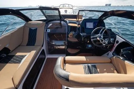 Slide: The Image of Luxurious 2026 Hanover 305 boat interior with premium seating and modern dashboard on open water. - 5