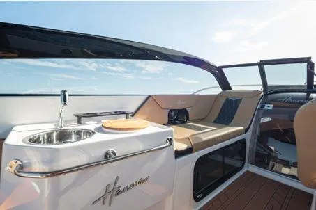 Slide: The Image of Luxurious interior of 2026 Hanover 305 White and Black Premium Edition boat with sleek design. - 6