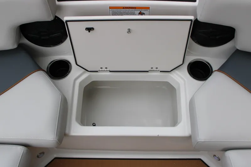 Slide: The Image of 2025 Starcraft SVX 211 OB boat interior storage compartment with cup holders. - 19
