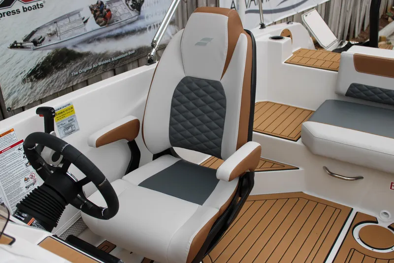 Slide: The Image of 2025 Starcraft SVX 211 OB boat interior with modern seating and steering wheel. - 9