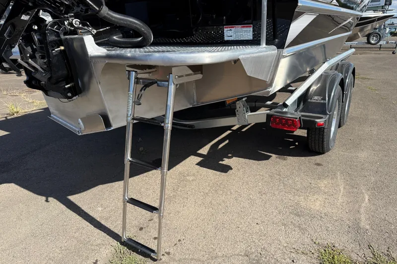 Slide: The Image of 2025 Thunder Jet 200 Luxor boat trailer with ladder and dual axle design. - 4