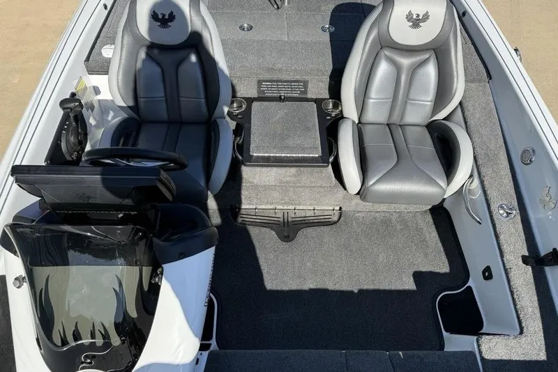 Slide: The Image of 2019 Phoenix 618 Pro boat interior with dual gray seats and steering console. - 11