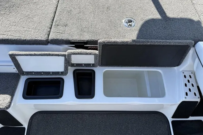 Slide: The Image of 2019 Phoenix 618 Pro boat storage compartments with carpeted lids and various container sizes. - 14