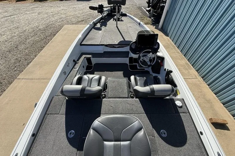 Slide: The Image of 2019 Phoenix 618 Pro boat interior with dual seats and steering console. - 15