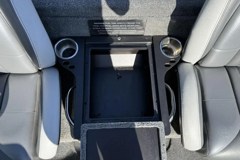 Slide: The Image of Interior of 2019 Phoenix 618 Pro boat with cup holders and storage compartment. - 21