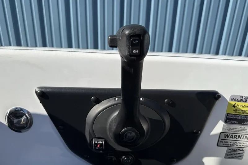 Slide: The Image of Boat throttle control on a 2019 Phoenix 618 Pro, with warning labels visible. - 3