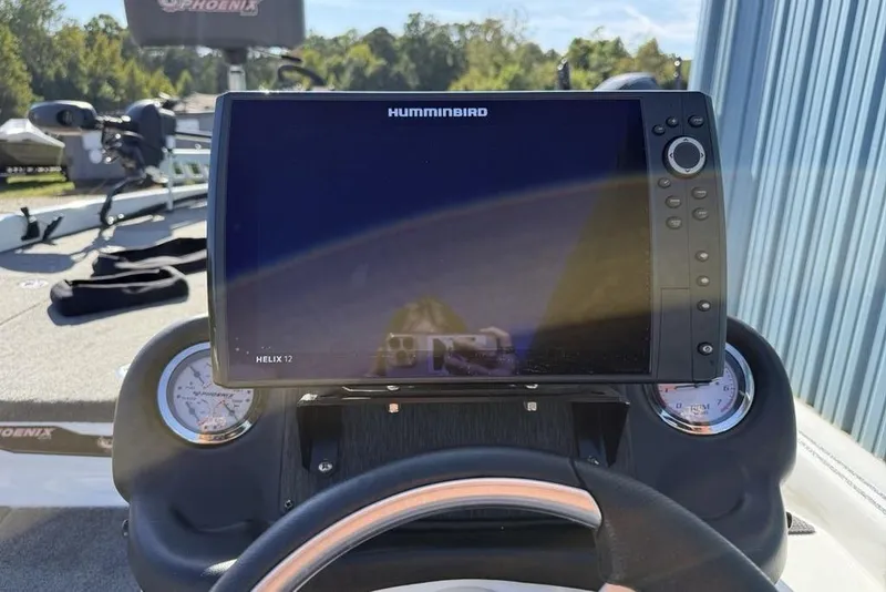 Slide: The Image of Helix 12 fishfinder on 2019 Phoenix 618 Pro boat dashboard. - 4